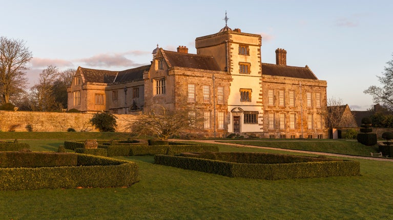 Sunset over the house and garden at Canon Ashby, Northamptonshire